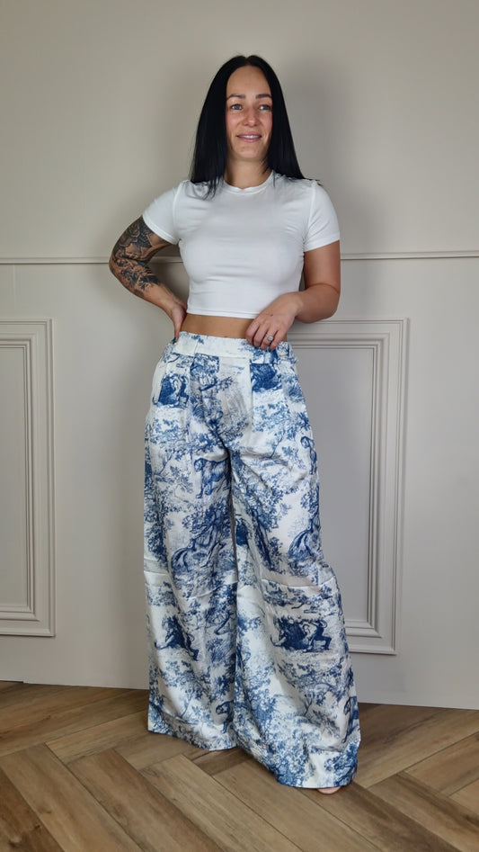 Elevate your wardrobe with our LAUREL porcelain print trousers. Expertly tailored with a flattering wide leg silhouette, these trousers are a statement piece that exude sophistication. The gorgeous porcelain print adds a touch of elegance, making these trousers perfect for any occasion.